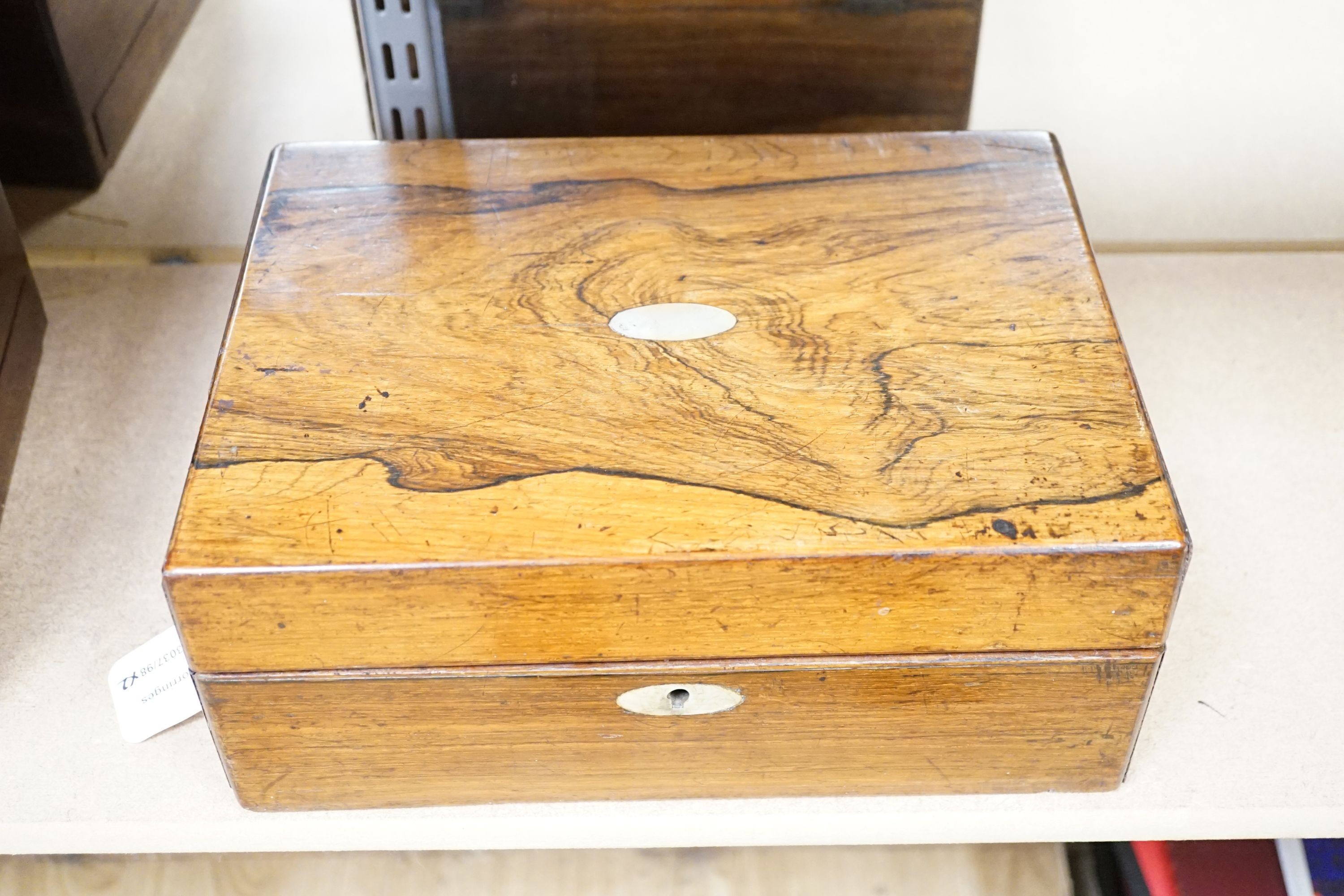 Two Victorian rosewood cased travelling vanity sets with silver plated covers (2)
